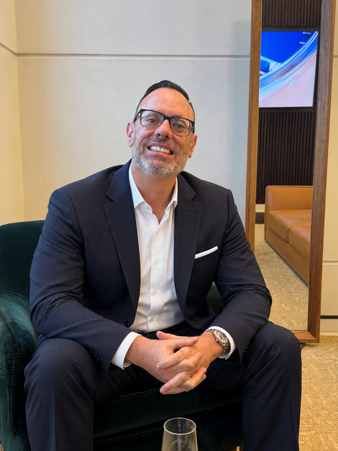 David Bombara seated and smiling